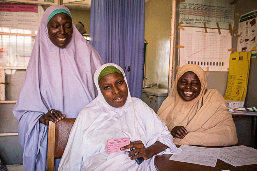 Traditional birth attendants counsel a pregnant woman on her postpartum family planning options.