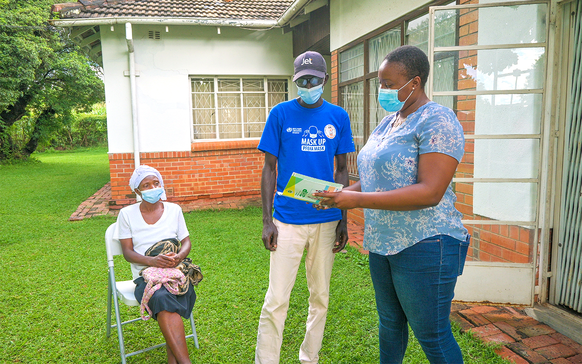 Makaita Gombe discusses 3HP with patient volunteer Stanley