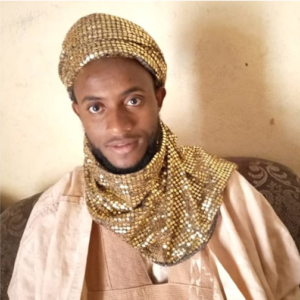 Traditional ruler Mallam Bello Usman looks at the camera.