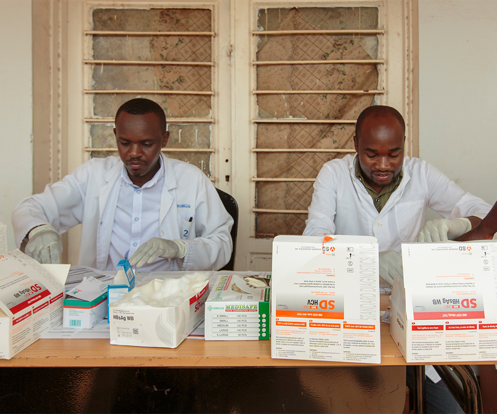 Pharmacists in Rwanda giving hepatitis treatment