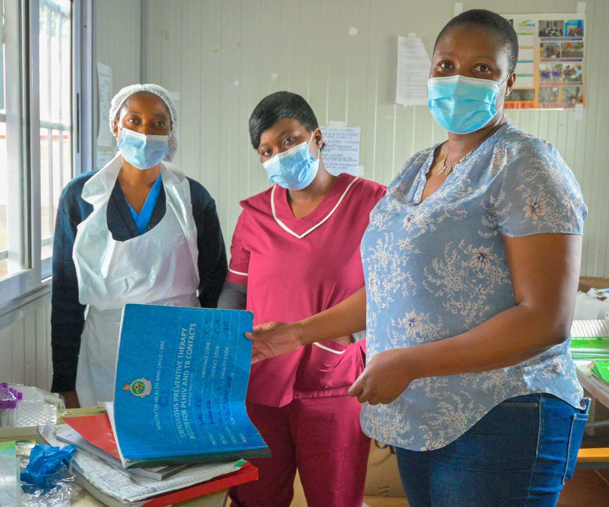 Health care providers Nyasha Zvarira (nurse) and Caroline Chinhengo (primary counsellor) with Maka Gombe at Highfields Polyclinic, Harare, Zimbabwe.