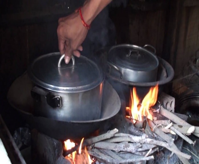 Two pots over a wood fire